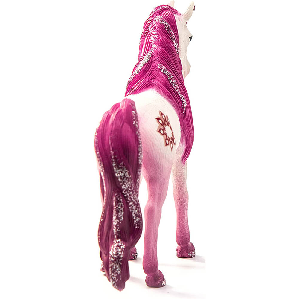 Schleich Bayala Mandala Unicorn Mare figurine with a white textured body, pink legs, glitter-streaked magenta mane and tail, and floral marking on its hindquarter, viewed from behind on white.
