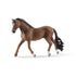 Schleich Horse Club Trakehner gelding figure features a textured brown coat, black mane and flowing tail, white lower legs, and a walking pose, displayed against a plain white background.